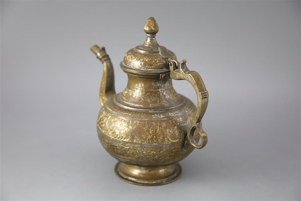 An 18th century Mughal Indian bronze and parcel gilt ewer, 26cm high